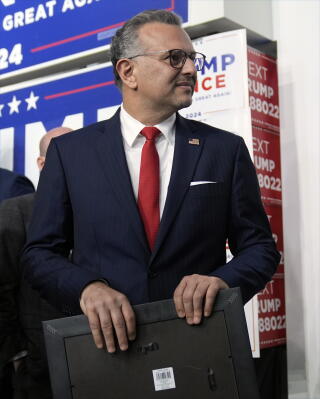 Massad Boulos watches from the sidelines at a Trump campaign event.