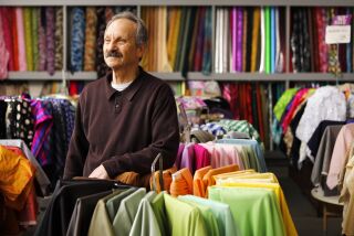 Michael Recht is the owner of Yardage Town, a longtime family fabric business, shown here at his National City store on Dec. 17, 2019. Several of the stores have closed and Recht plans to close the rest of them next year.
