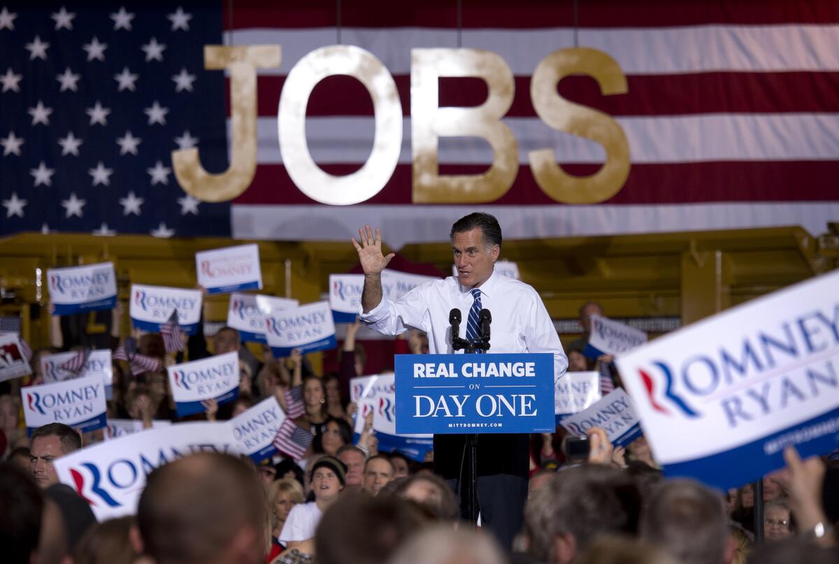 Republican presidential candidate Mitt Romney holds a rally at Screen Machine Industries in Etna, Ohio.