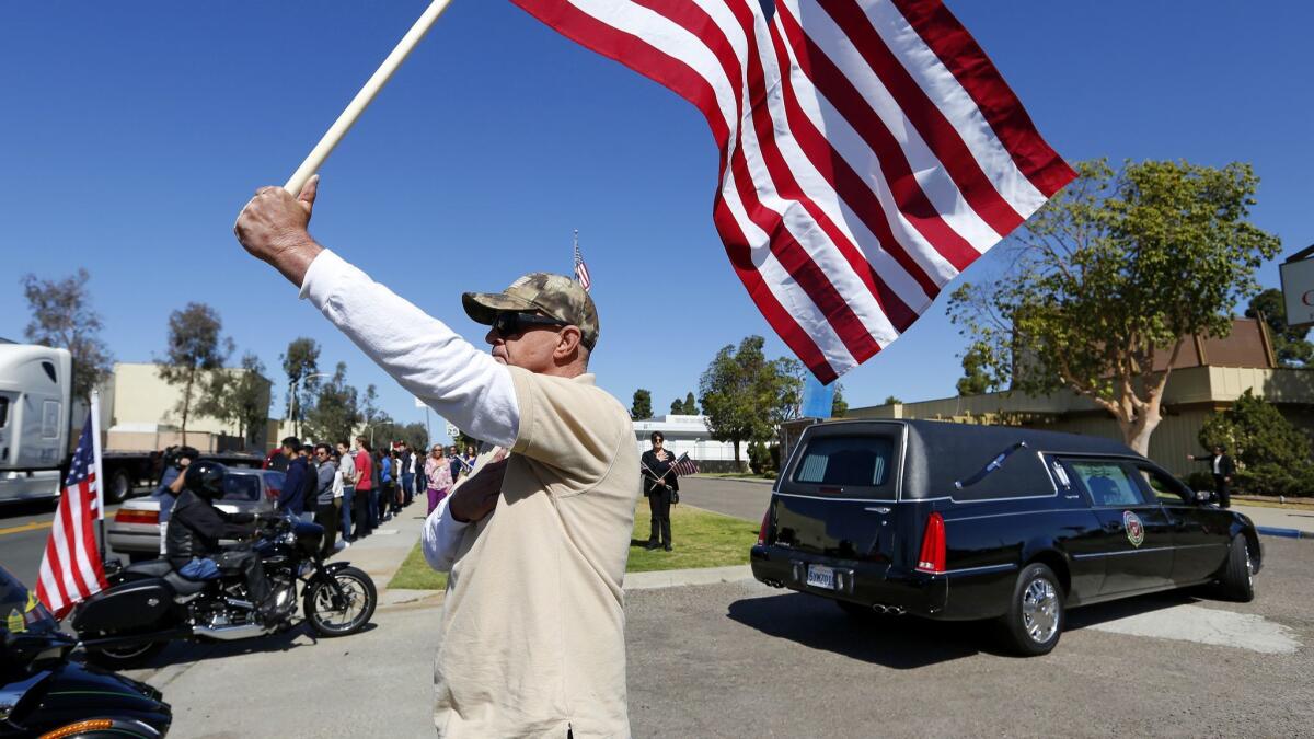 Residents lined the streets as the funeral procession for Gunnery Sgt. Derik Holley arrived at the Clairemont Mortuary.