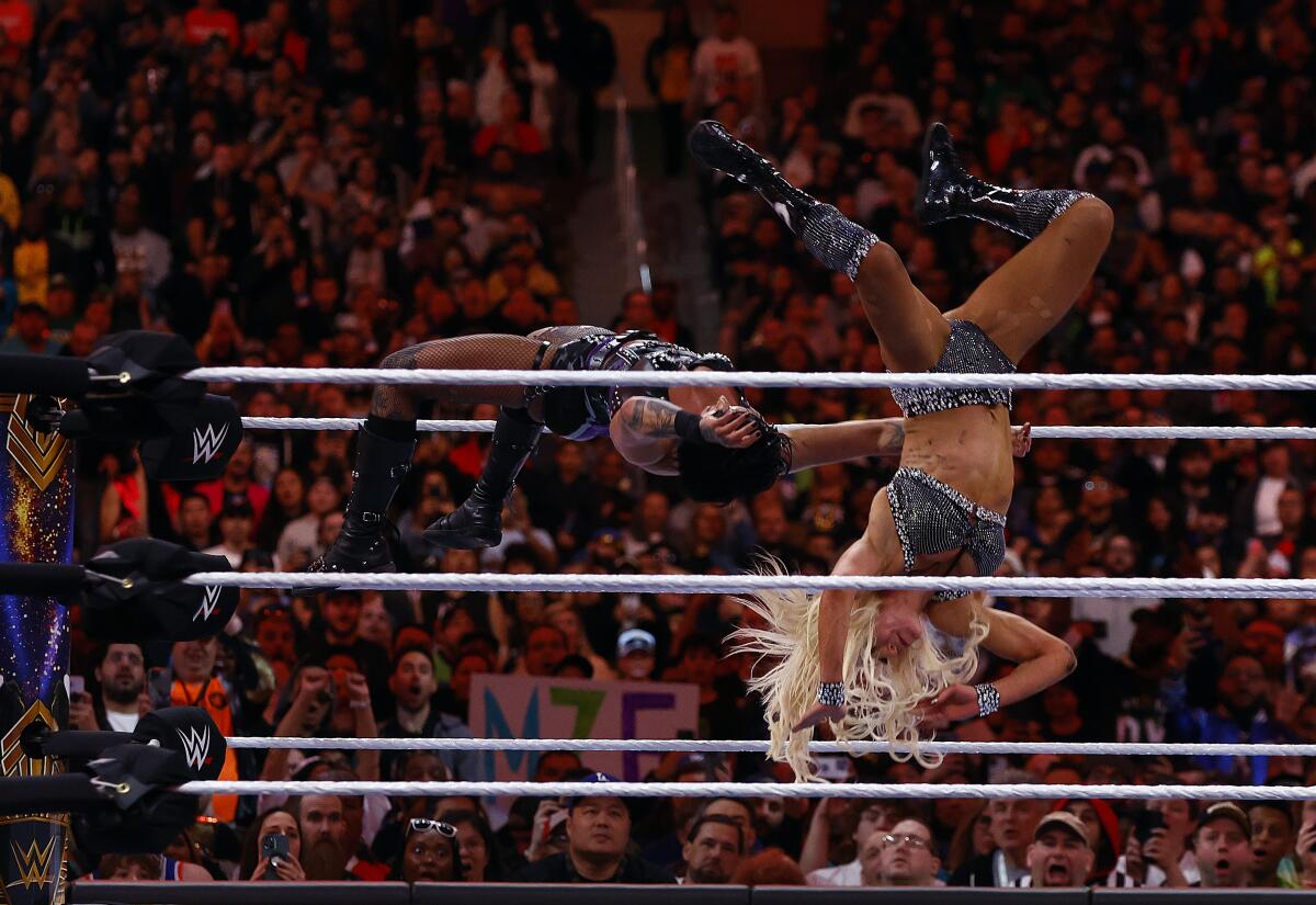 Rhea Ripley and Charlotte Flair wrestle for the Smackdown women’s championship at Wrestlemania.