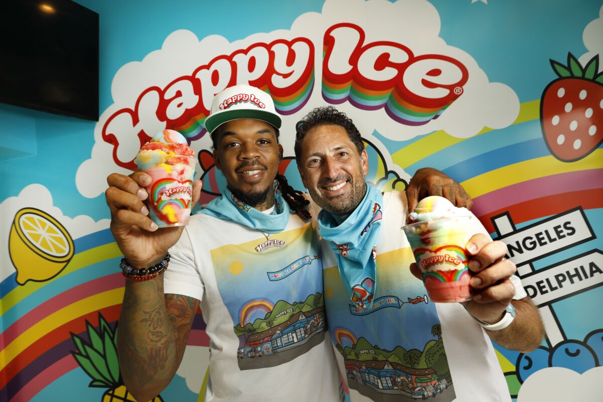 Lemeir Mitchell and partner Ted Foxman on opening day of Happy Ice, a water ice shop on Melrose Avenue.