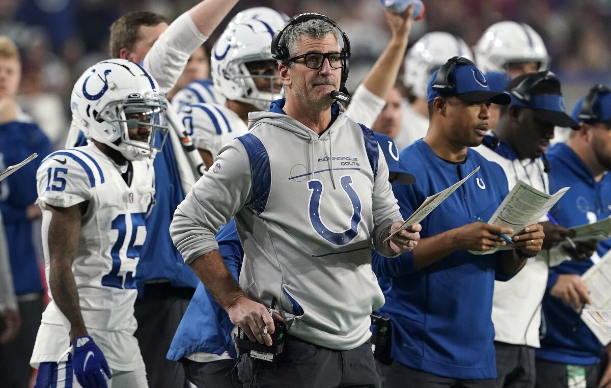 FILE - Indianapolis Colts head coach Frank Reich watches his team the Arizona Cardinals during an NFL football game Saturday, Dec. 25, 2021, in Glendale, Ariz. A year after he became head coach of the Indianapolis Colts, Reich and his wife, Linda, formed kNot Today, a nonprofit that works to prevent child sexual abuse and exploitation. Their foundation is among five organizations working together at the 2022 Super Bowl to combat sex trafficking, which is often heightened around major events. (AP Photo/Darryl Webb, File)