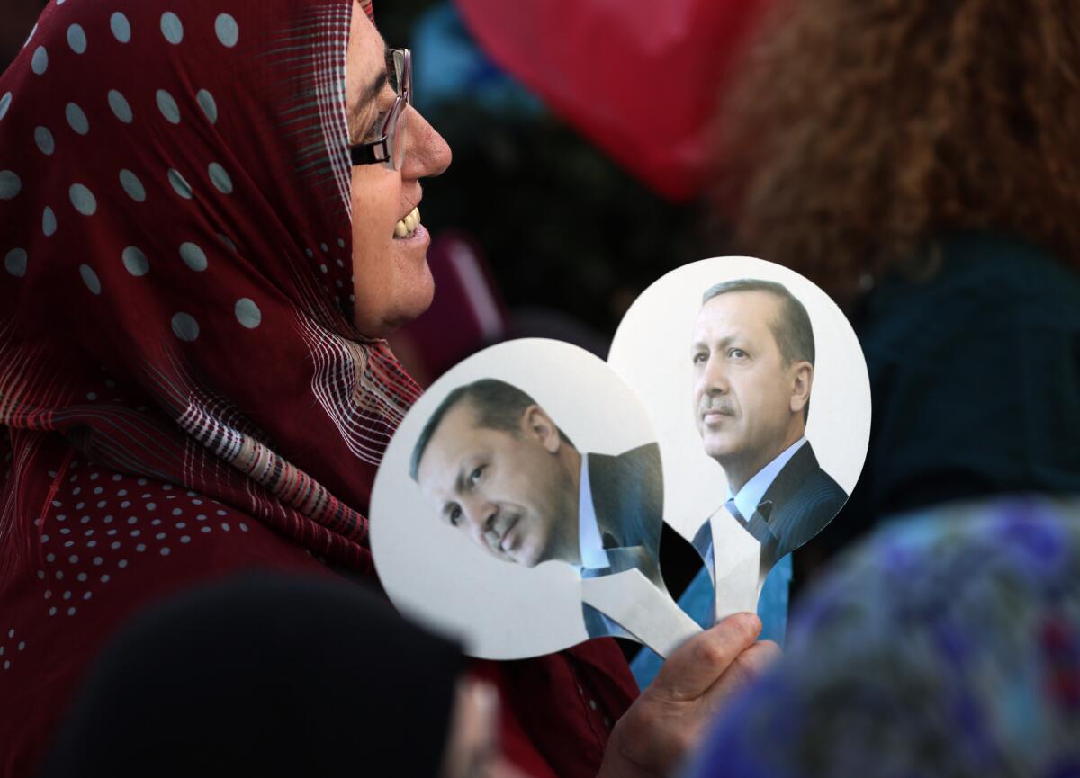 A supporter of Turkish Prime Minister Recep Tayyip Erdogan at a rally in Ankara, the capital. Turks go the polls Sunday to choose a president by direct vote for the first time.