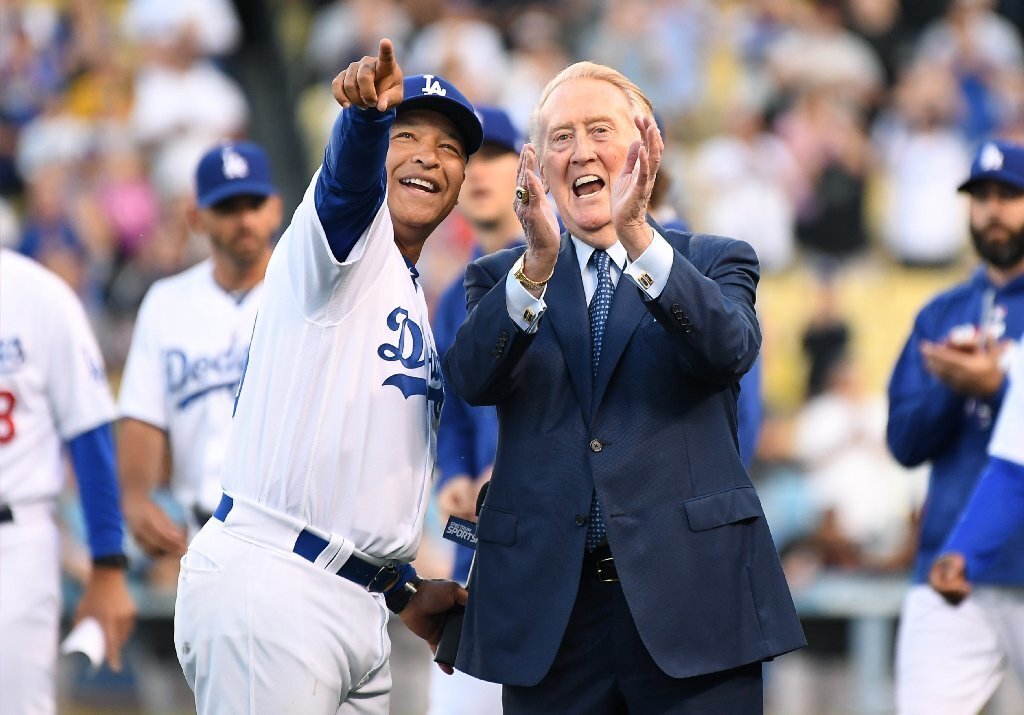 Dodgers manager Dave Roberts and Vin Scully smile during as the former broadcaster is inducted into the Ring of Honor at Dodger Stadium on May 3.