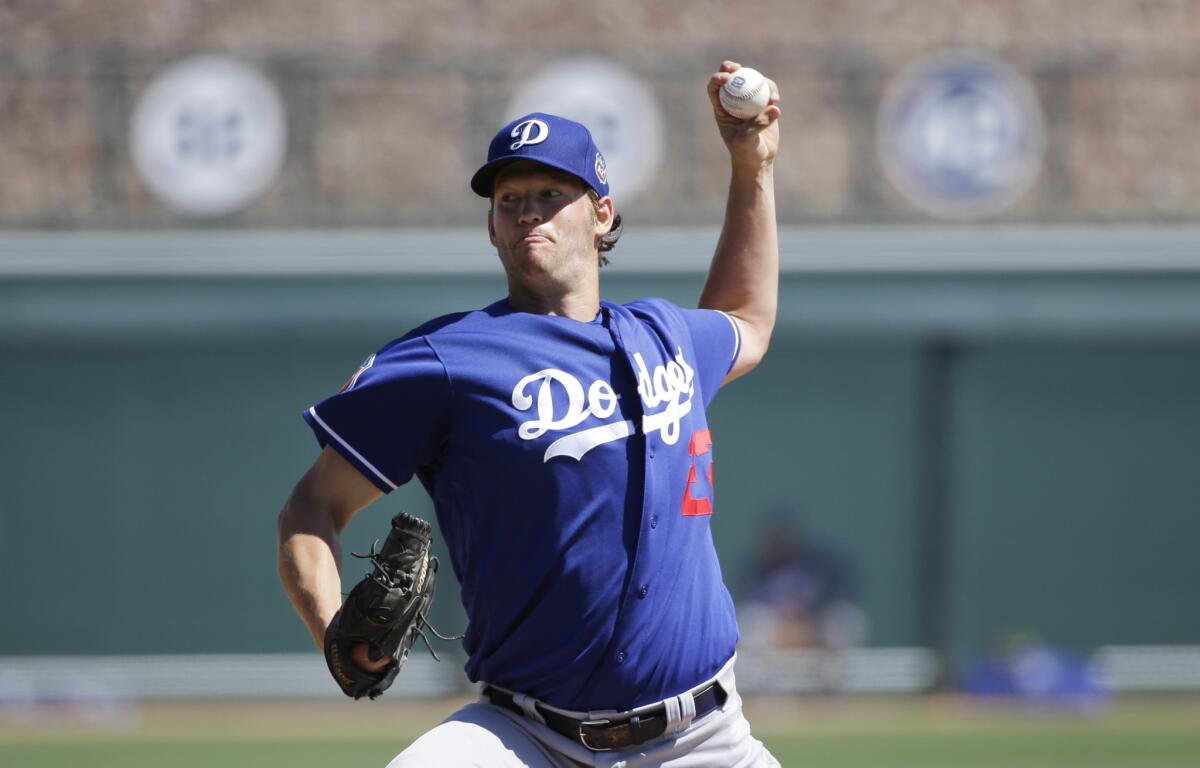 Los Angeles Dodgers starting pitcher Clayton Kershaw throws against the Chicago White Sox during a spring training baseball game.