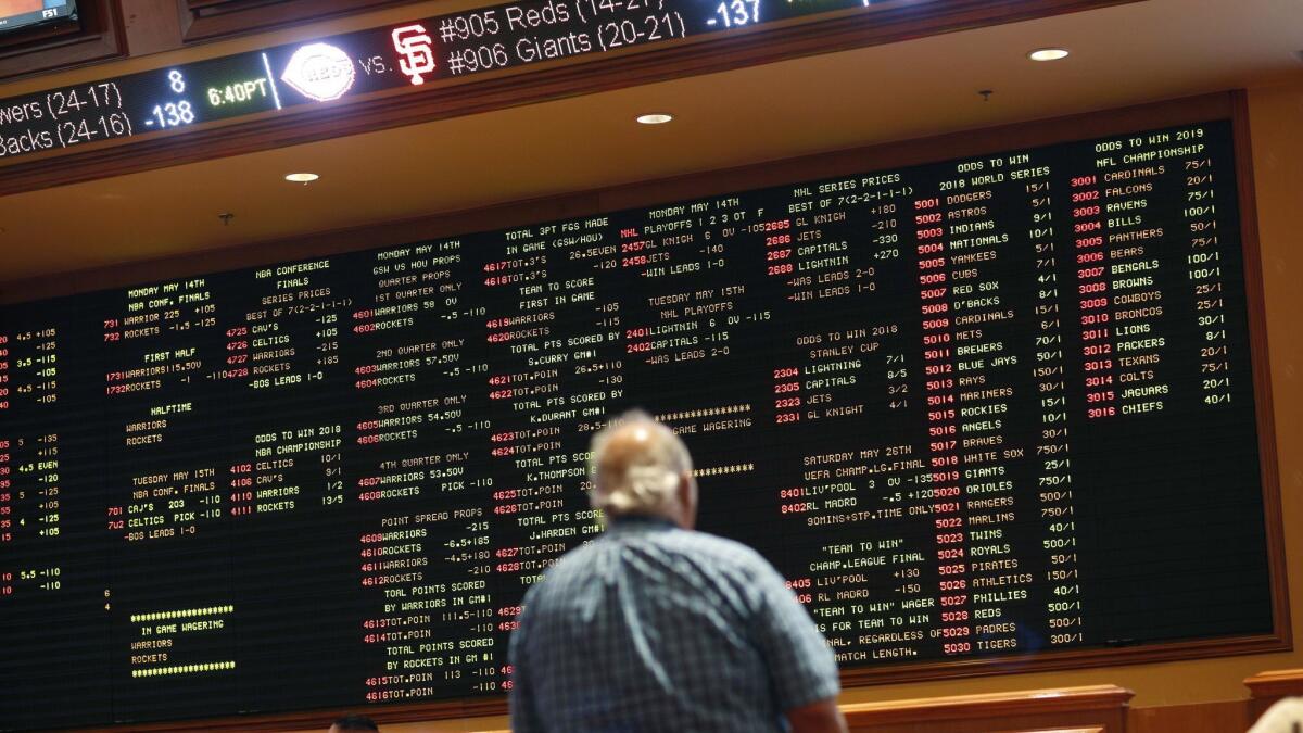 Betting odds are displayed on a board in the sports book at the South Point hotel and casino in Las Vegas. A U.S. Supreme Court decision has cleared the way for states to legalize sports betting.