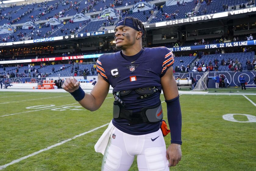 Chicago Bears' Justin Fields leaves the field after an NFL football game against the Green Bay Packers Sunday, Dec. 4, 2022, in Chicago. The Packers won 28-19. (AP Photo/Nam Y. Huh)