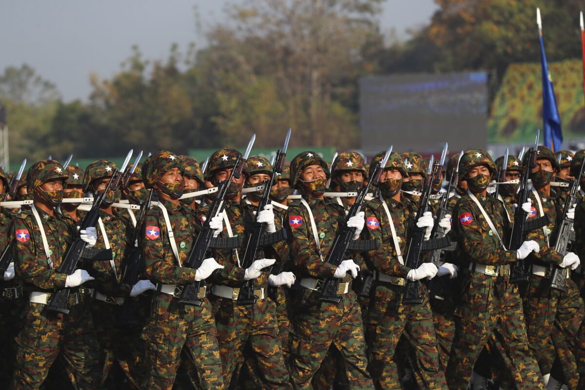 Soldiers march during a ceremony to mark Myanmar's 75th anniversary Union Day in Naypyitaw, Myanmar, Saturday, Feb. 12, 2022. The occasion is celebrated for the date in 1947 when many of the country's ethnic groups signed an agreement to unify following decades of British colonial rule, but it was ineffective, and efforts at unity remain failed. (AP Photo)