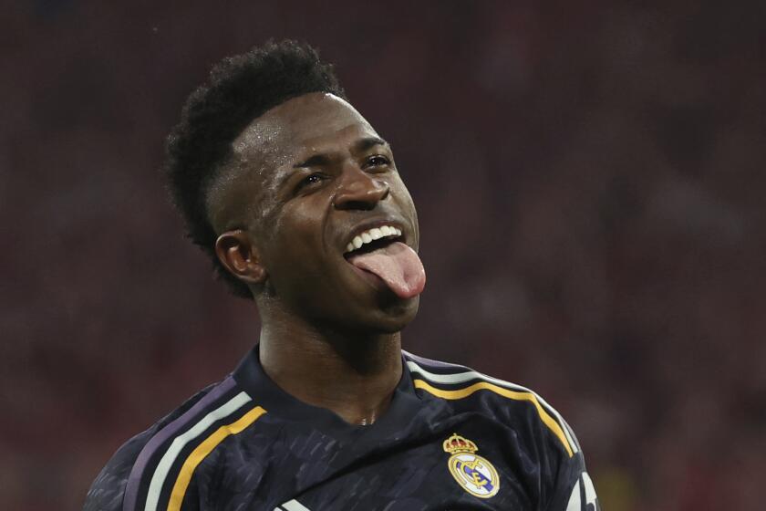 Madrid's Vinicius Junior celebrates after scoring his side's second goal by penalty during the Champions League, semifinal first leg, soccer match between FC Bayern Munich and Real Madrid in Munich, Germany, Tuesday, April 30, 2024. (Matthias Balk/dpa via AP)