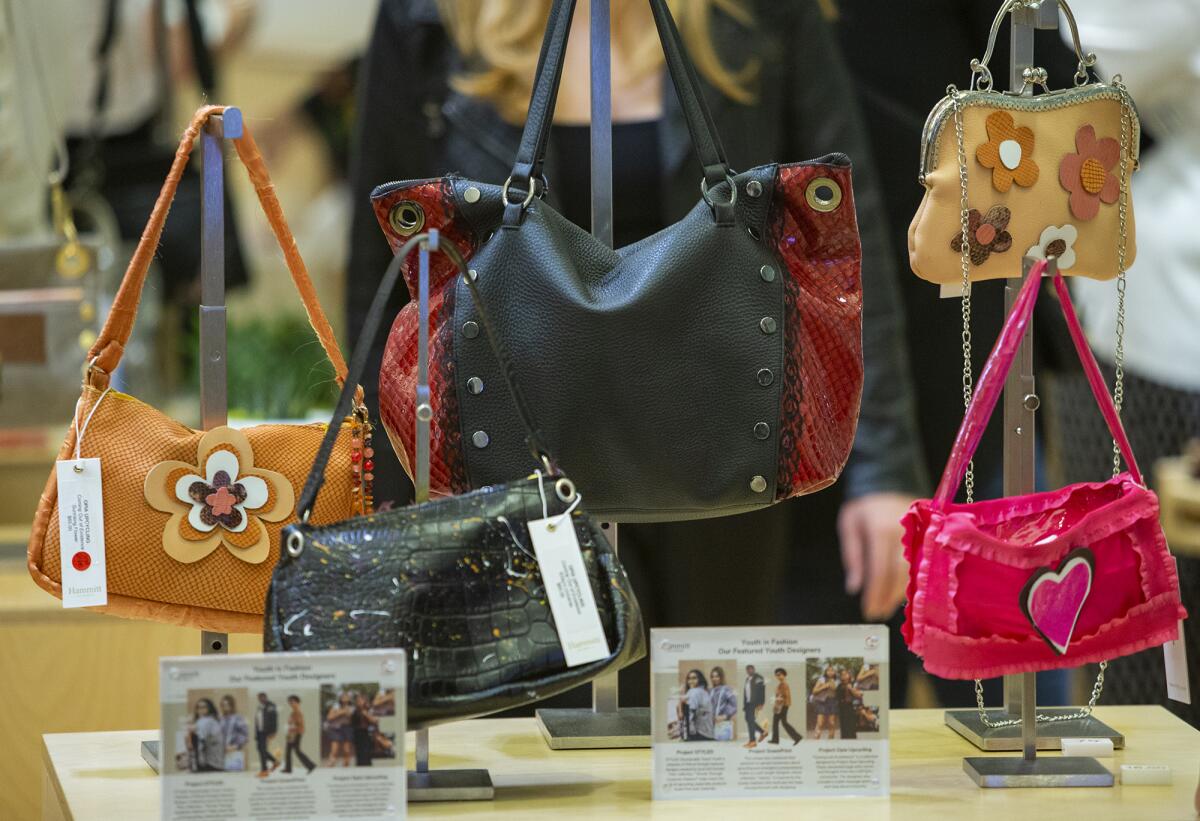 Handbags designed by Team Opia Upcycling are on display at Hammitt - South Coast Plaza on Thursday, Aug. 19.