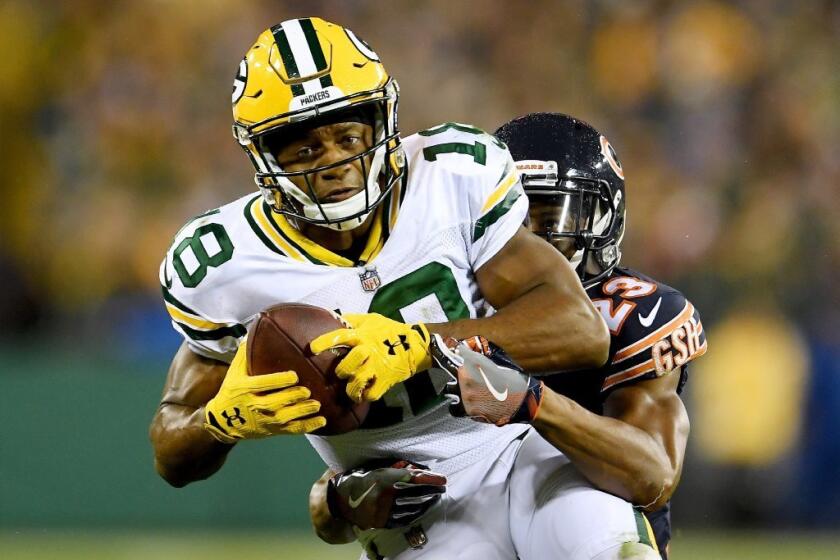 Green Bay Packers receiver Randall Cobb makes a catch in fron of Chicago Bears cornerback Kyle Fuller on Sept. 28.