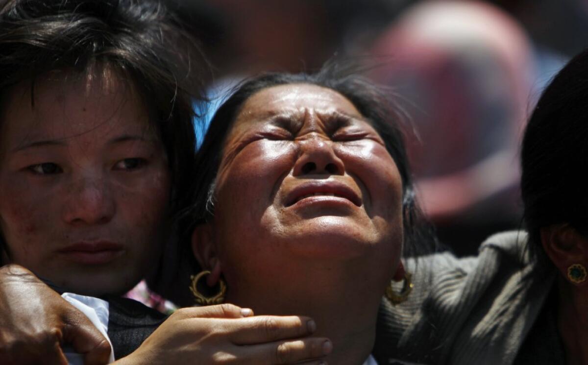 Relatives mourn the Sherpa guides who died on Mt. Everest