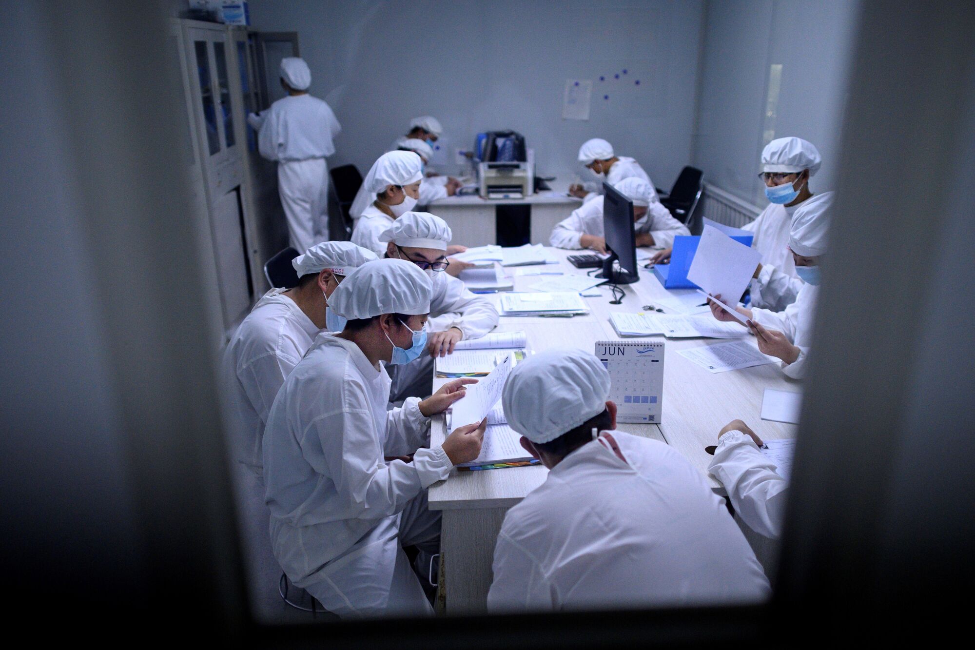 Researchers work in a lab at Yisheng Biopharma, one of a number of companies in China trying to develop a COVID-19 vaccine. 