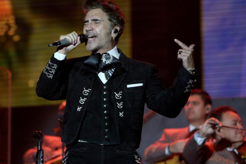 Alejandro Fernandez performs at the Besame Mucho 2023 event at Dodger Stadium on Saturday, Dec. 2, 2023.