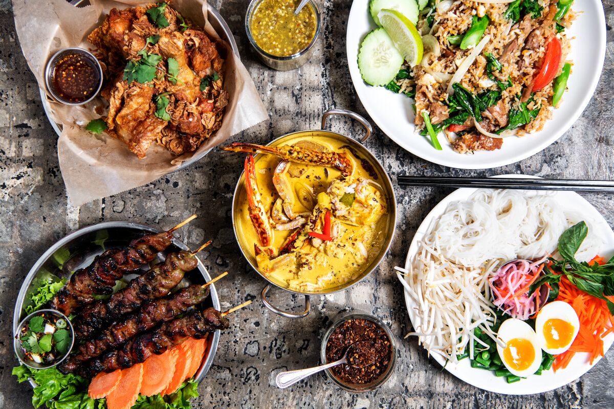 Some of our critic’s favorite dishes at Luv2eat Thai Bistro in Hollywood include (clockwise from top) Hat Yai fried chicken, roasted duck rice, crab curry and moo-ping (grilled pork).