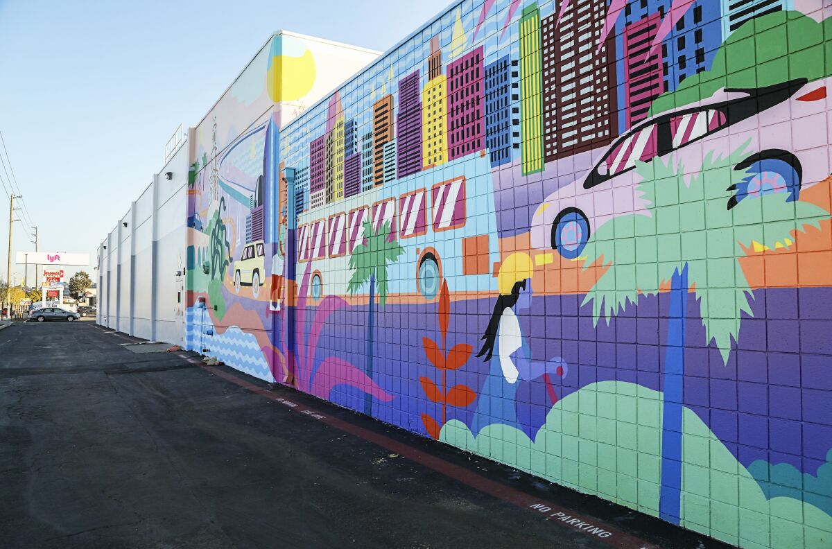 This is a mural by artist Celeste Byers on the side of the Lyft Driver Center.