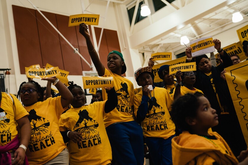 Education activists demonstrate in December for better schools. Oakland, like Los Angeles, has a charter-heavy school district where school board elections can become proxy wars between charter school proponents and foes.
