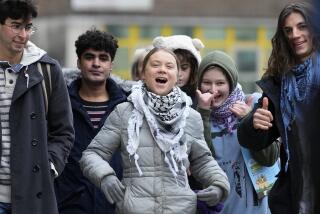 Environmental activist Greta Thunberg, centre, arrives with other protesters at Westminster Magistrates Court in London, Friday, Feb. 2, 2024. A judge has acquitted climate activist Greta Thunberg of a charge that she had refused to leave a protest that blocked the entrance to a major oil and gas industry conference in London last year. Thunberg was acquitted along with four other defendants. (AP Photo/Kirsty Wigglesworth)