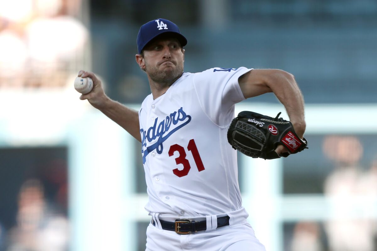 Los Angeles Dodgers starting pitcher Max Scherzer throws to a Houston Astros batter during the first inning of a baseball game in Los Angeles, Wednesday, Aug. 4, 2021. (AP Photo/Alex Gallardo)