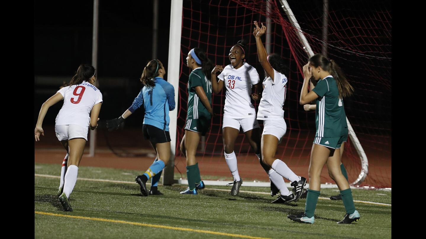 Los Alamitos' Khalia Gathright (33) celebrates after scoring a gaoal against Edison during a Sunset League game on Tuesday, January 30.
