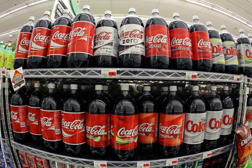Coca-Cola products on a San Francisco store shelf.