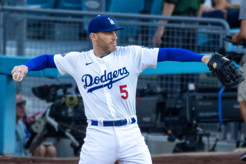 Los Angeles, CA - July 05: Dodgers first baseman Freddie Freeman #5 throws the ball.