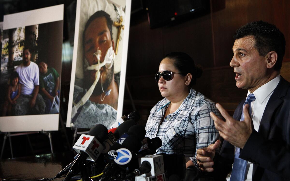 Fermin Vincent Valenzuela's ex wife, Patty Gonzales, and attorney Garo Mardirossian at a news conference at Mardirossian's law office in Los Angeles.