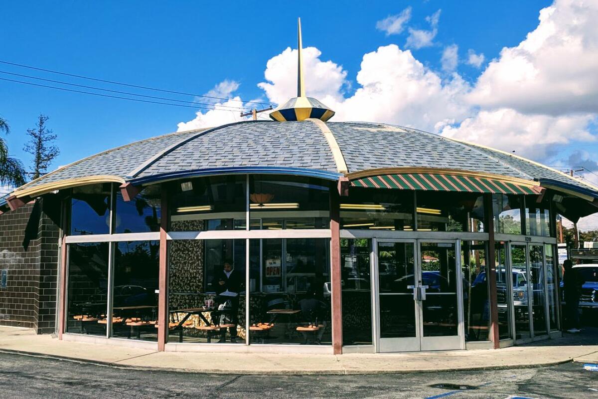 The Brolly Hut restaurant sits under a roof in the shape of an open umbrella.