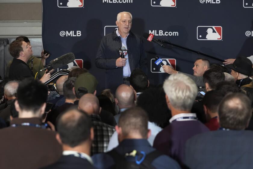 Joel Wolfe, agent for Japanese player Roki Sasaki, speaks to reporters at the Major League Baseball winter meetings in Dallas, Tuesday, Dec. 10, 2024. (AP Photo/Tony Gutierrez)