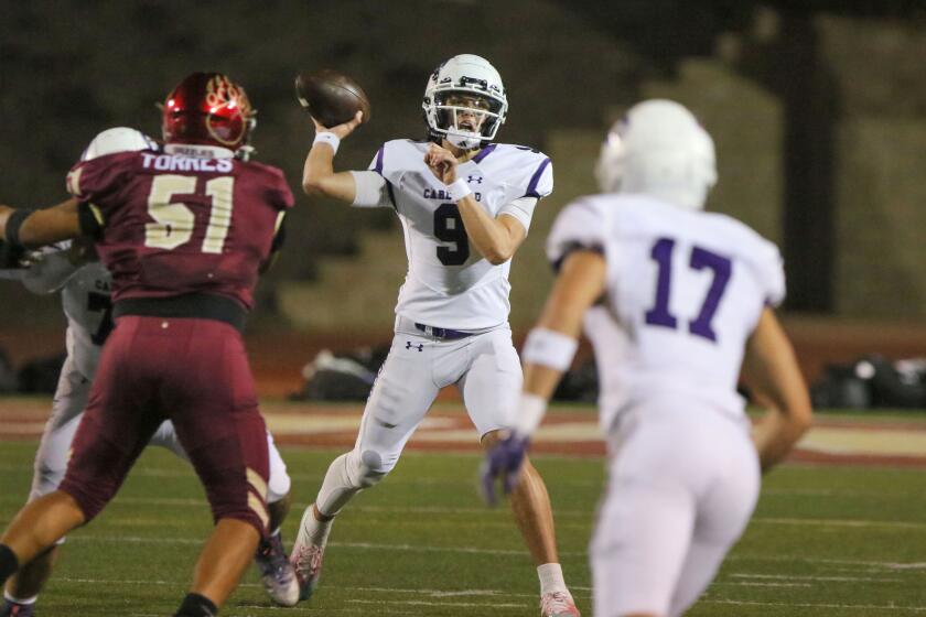 San Marcos, CA - September 29: Prep Football, Carlsbad at Mission Hills_Carlsbad quarterback Julian Sayin throws for a completion. (Charlie Neuman / For The San Diego Union-Tribune)