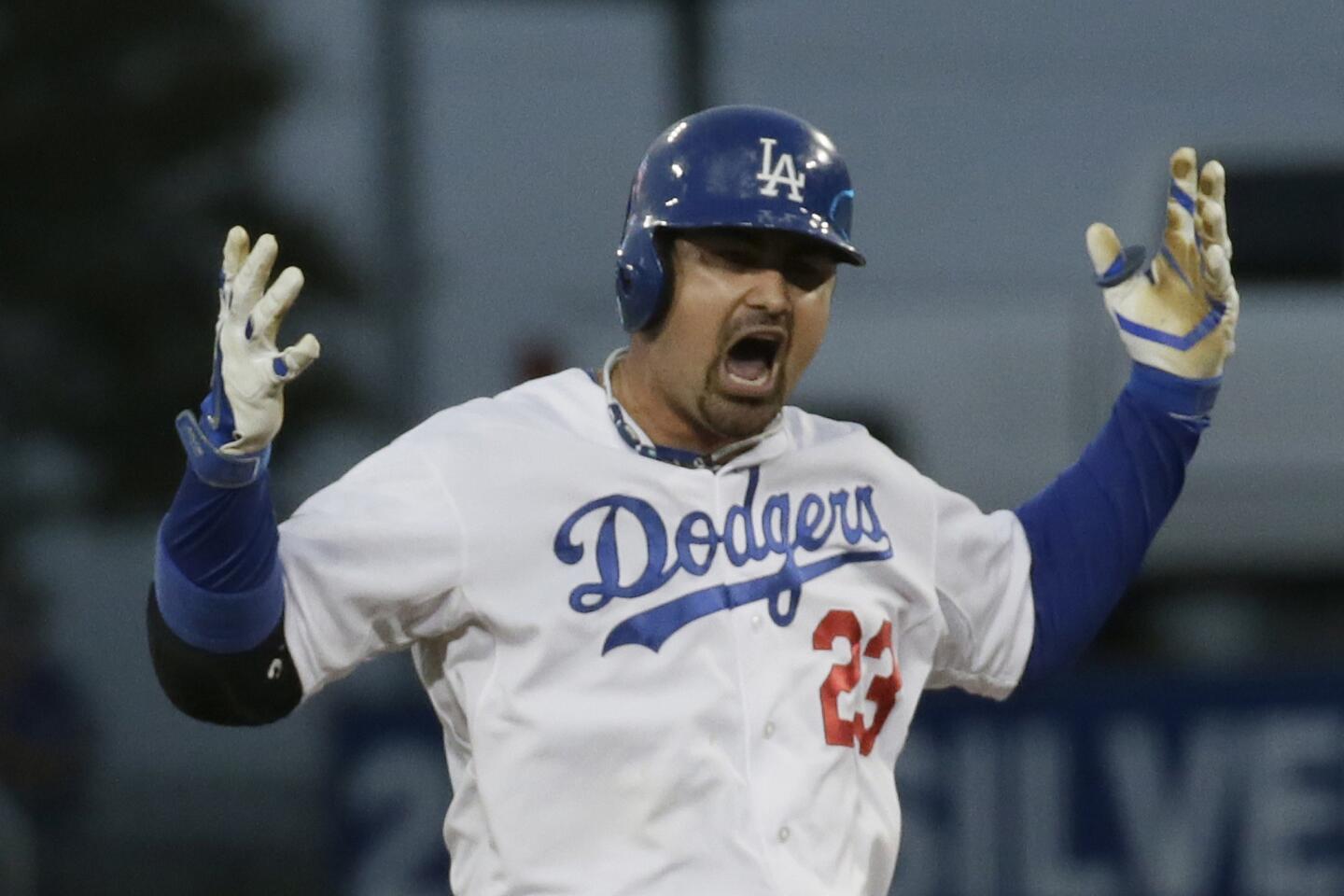 Dodgers first baseman Adrian Gonzalez celebrates after hitting a run-scoring double during the fourth inning of Game 3 of the NLCS against the St. Louis Cardinals.