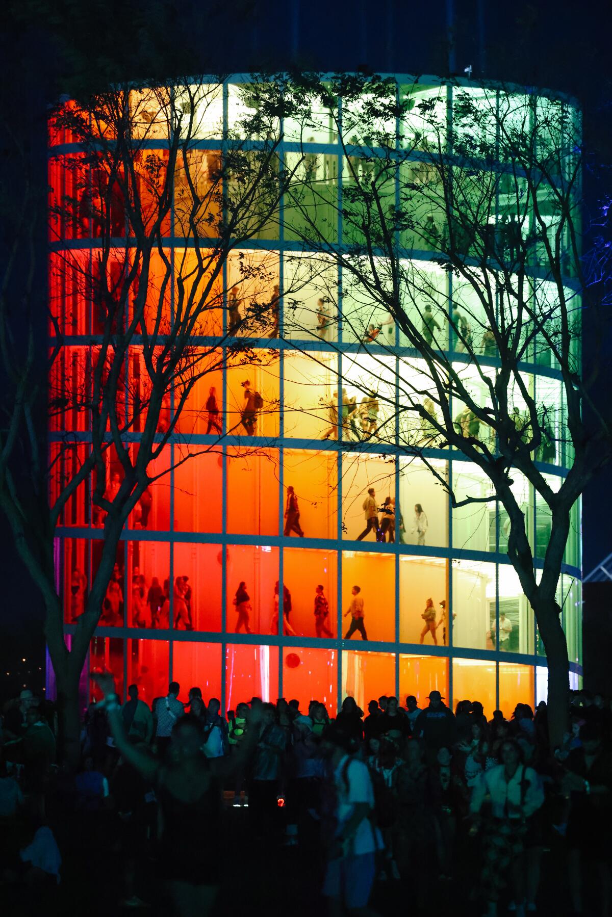 People walk up the spectra art installation at Coachella on Friday, April 14, 2023 in Coachella Valley, CA.