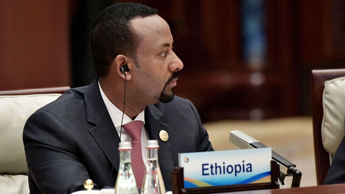 A surge in communal violence has coincided with the early days of Ethiopian Prime Minister Abiy Ahmed’s tenure. Ahmed is shown last month at a conference in Beijing.