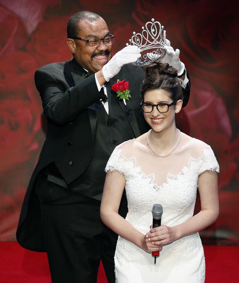 Seemingly with glee, Tournament of Roses President Gerald Freeny puts the crown of the Rose Queen on Rose Queen Louise Deser Siskel at the announcement and coronation of the Tournament of Roses Rose Queen at the Pasadena Playhouse on Tuesday, October 23, 2018. Louise Deser Siskel, of Sequoyah High School, was selected as the 101st Rose Queen to represent the 2019 Tournament of Roses Rose Court.