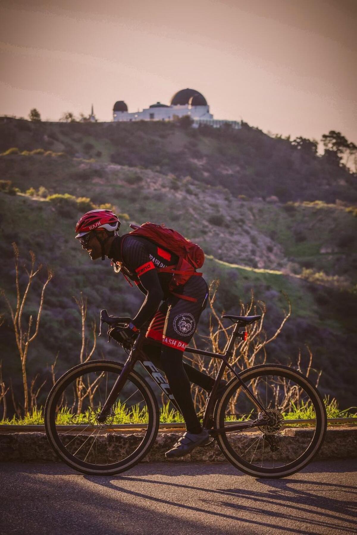 Michael Runnels biking down a hill in Griffith Park