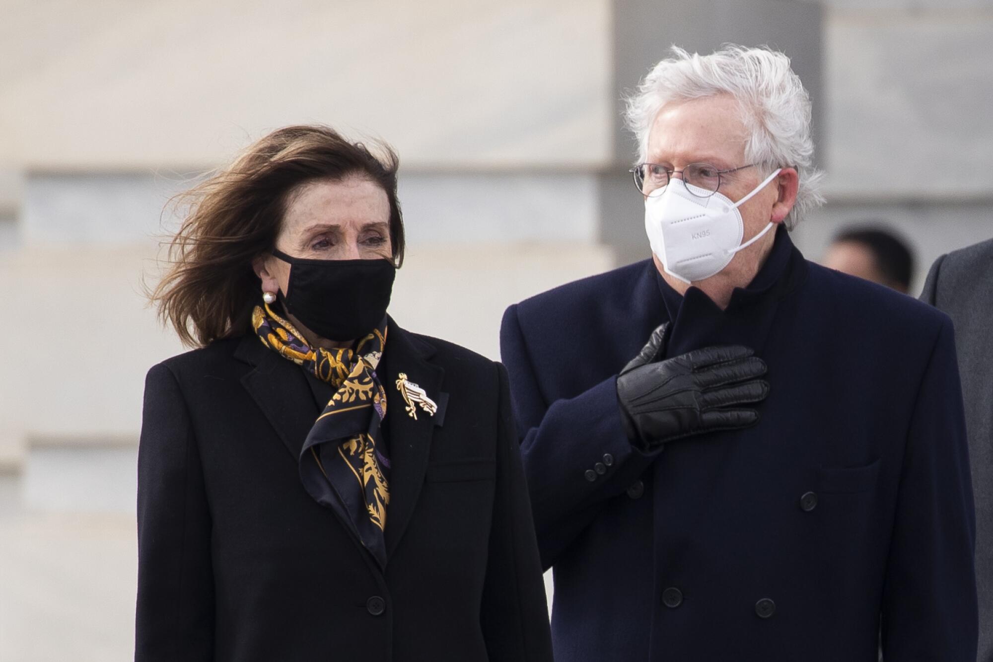 Nancy Pelosi and  Mitch McConnell outside the Capitol