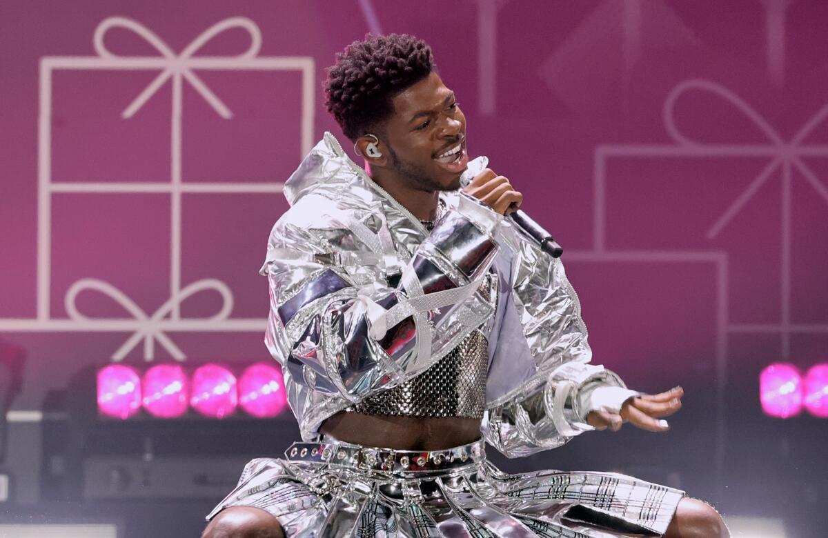 Lil Nas X kisses male dancer in fiery BET Awards performance