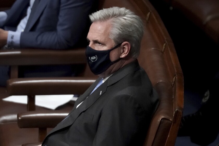 House Minority Leader Kevin McCarthy listens during arguments over certifying the electoral college vote on Jan. 6. 