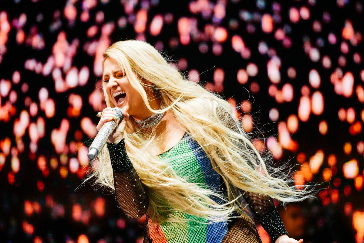 Meghan Trainor performing at L.A. Pride 2019  in a rainbow leotard.