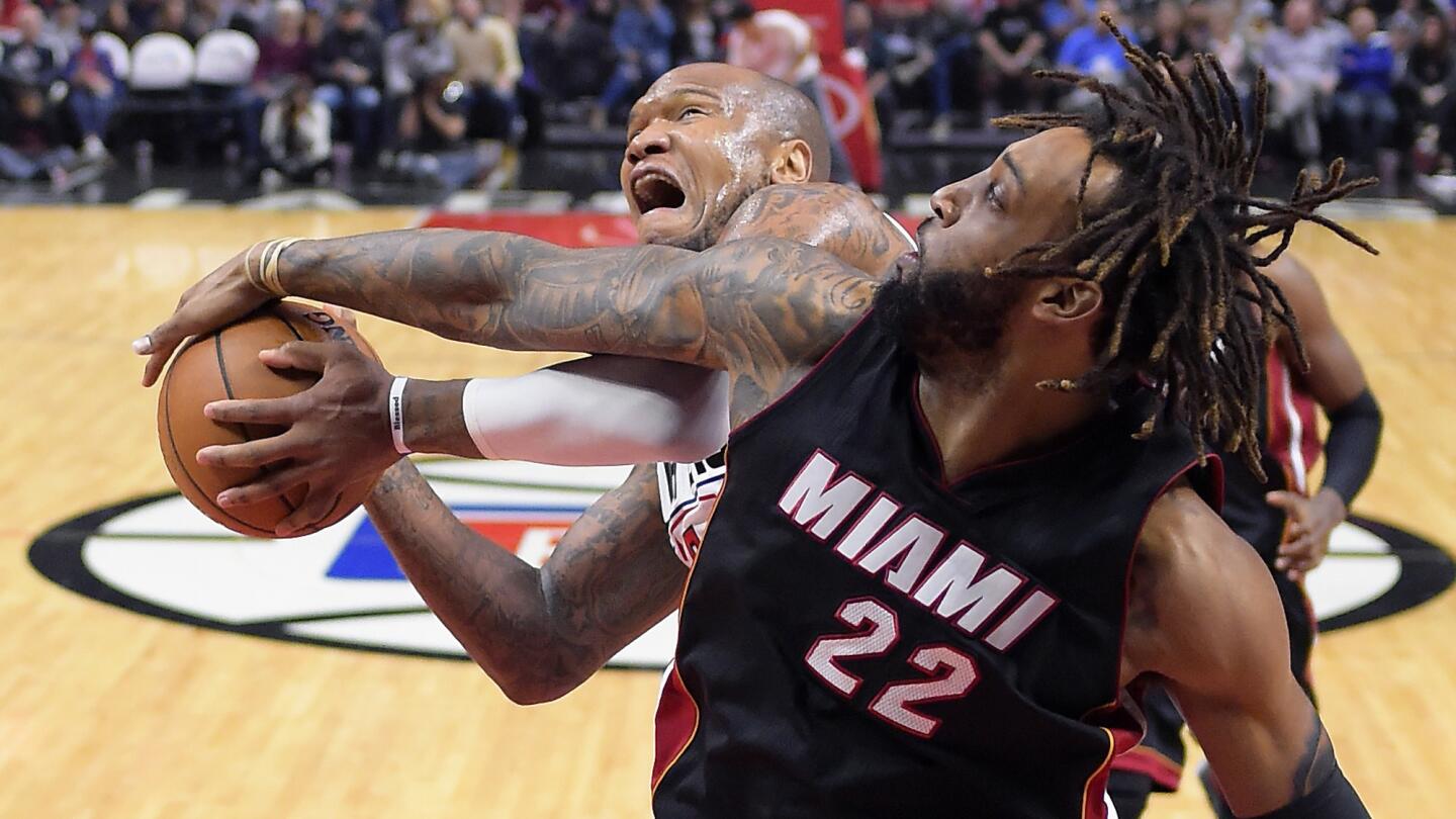 Heat forward Derrick Williams blocks a shot by Clippers center Marreese Speights during the second half.