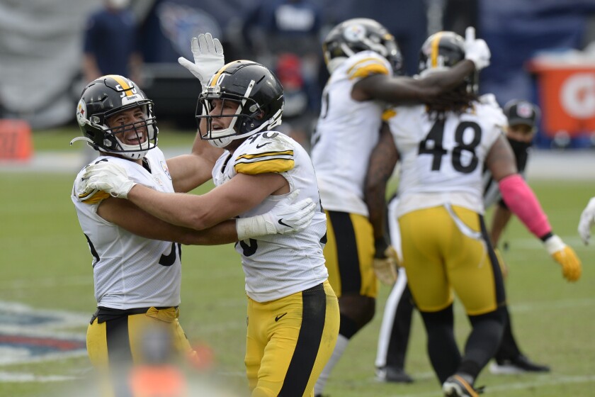 Pittsburgh Steelers linebackers Alex Highsmith (56) and T.J. Watt (90) celebrate after a 45-yard field goal attempt by Tennessee Titans kicker Stephen Gostkowski was no good in the final seconds of the fourth quarter in an NFL football game Sunday, Oct. 25, 2020, in Nashville, Tenn. The Steelers won 27-24. (AP Photo/Mark Zaleski)