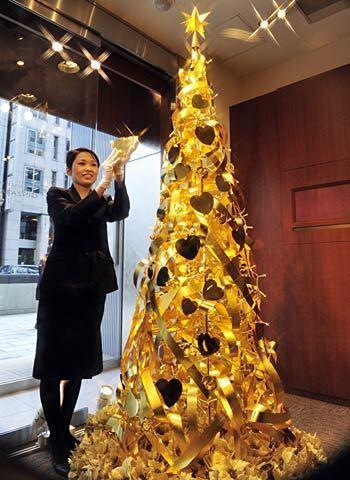 What this tree lacks in height, it makes up in cost. The tree, which is on display in the Tokyo store of Japanese jewelry retailer Tanaka Kikinzoku, is crafted out of gold. It stands a little under 8 feet but is valued at about $2 million.