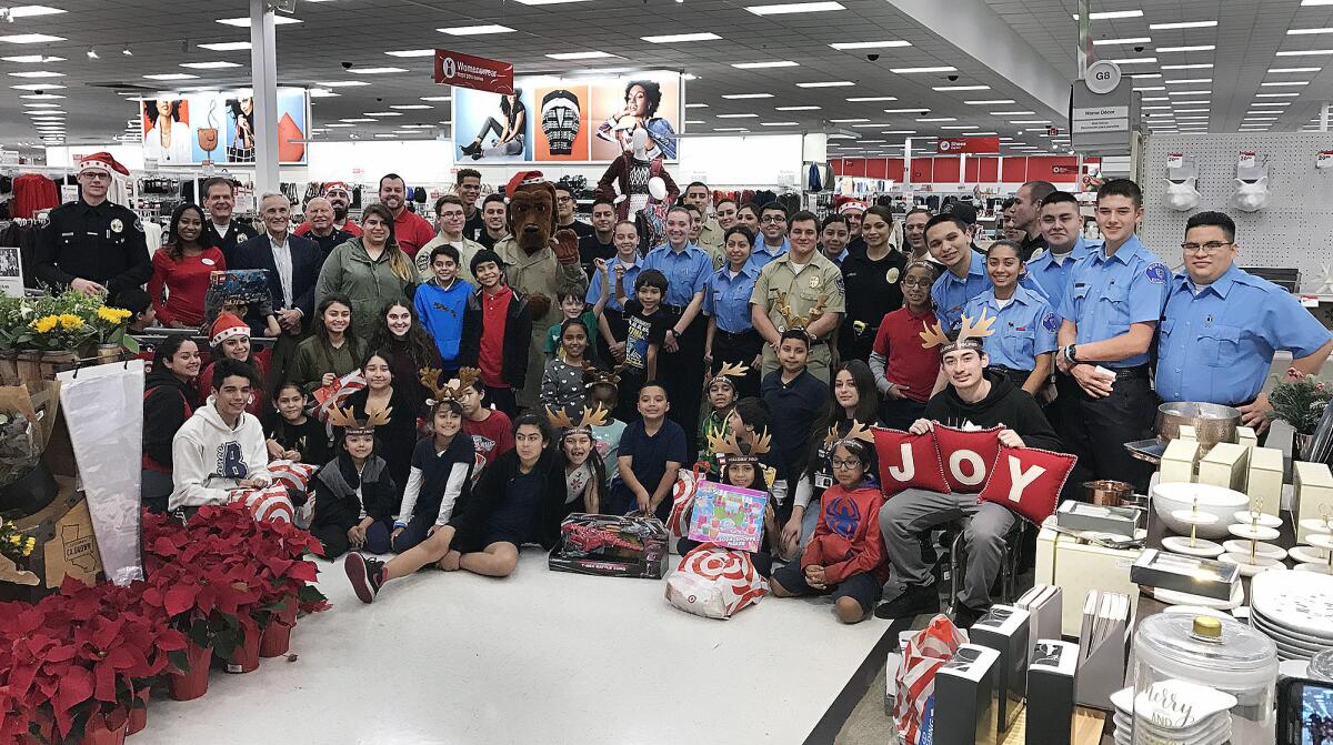 All of the children gather with Burbank law enforcement and Target employees during the "Shop with a Cop" event.