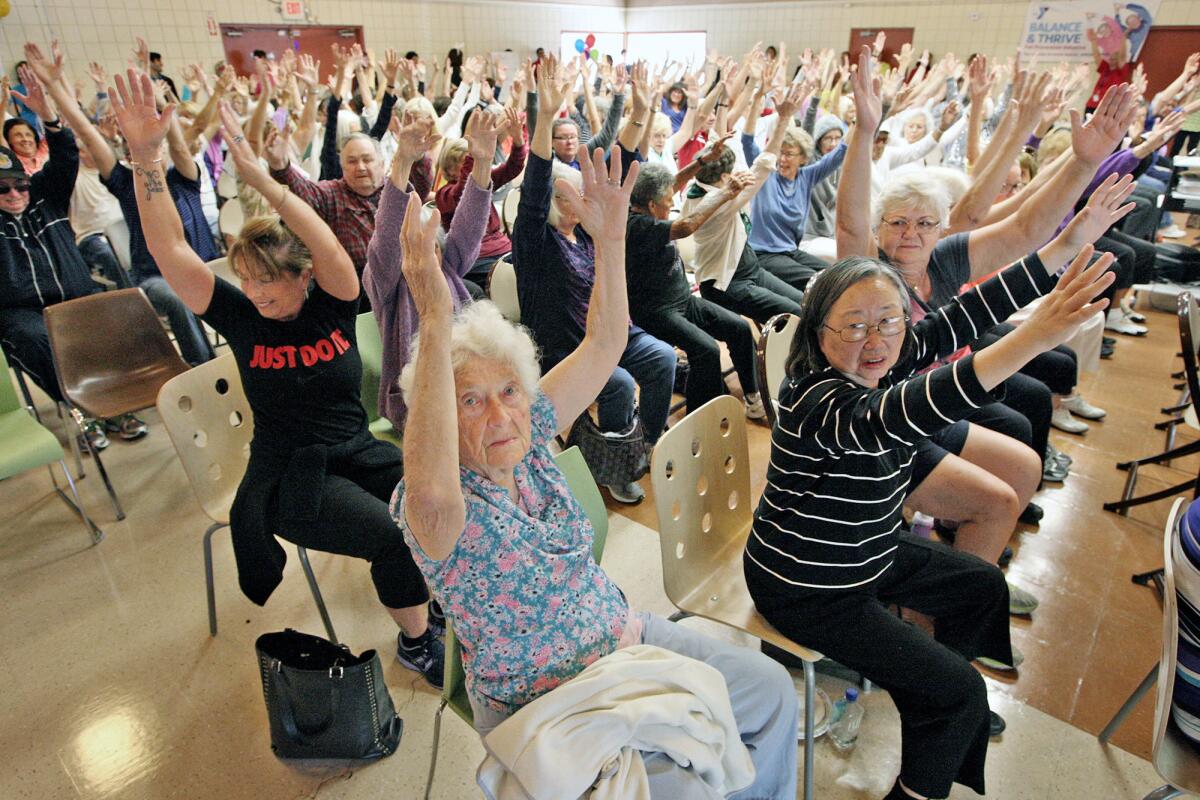 Seniors work on their balance skills during a kickoff of the Crescenta-Cañada YMCA's new Healthy Living program called Balance and Thrive for people 65 and older.