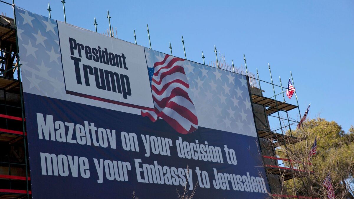 A sign hangs on a building under construction in Jerusalem congratulating U.S. President Donald Trump, Friday, Jan. 20. Trump has vowed to move the U.S. embassy from Tel Aviv to more controversial Jerusalem.