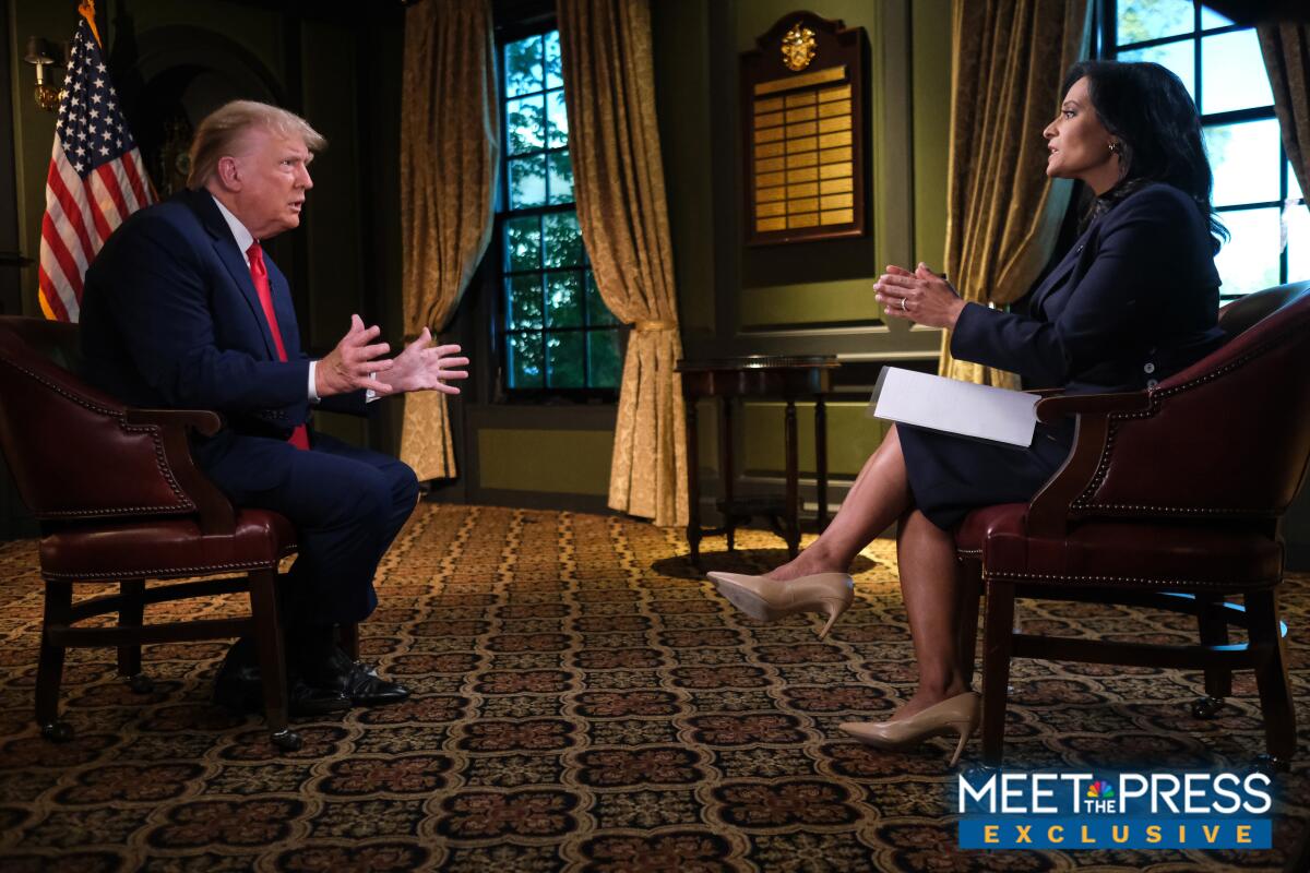 Donald Trump gestures during an interview with Kristen Welker.