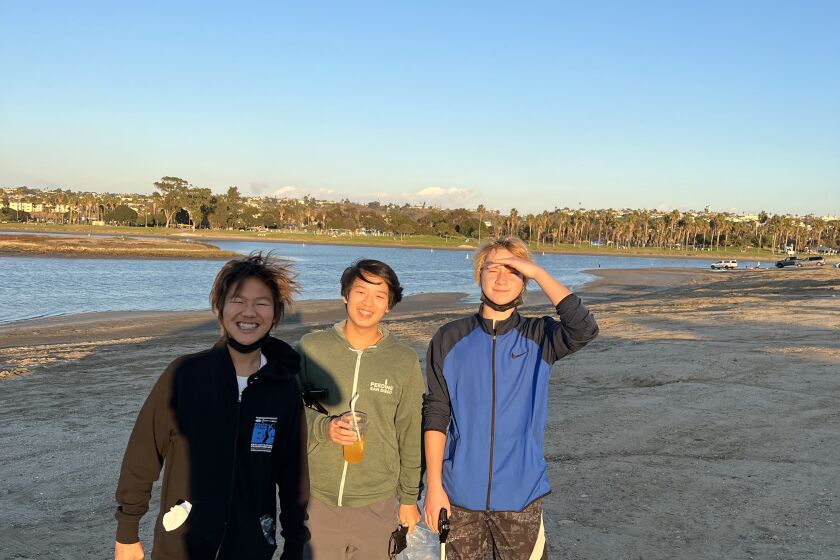 Forsocialgoods members Christopher Kam, Arthur Wang and Gavin Wendt at a beach clean-up at Mission Bay.