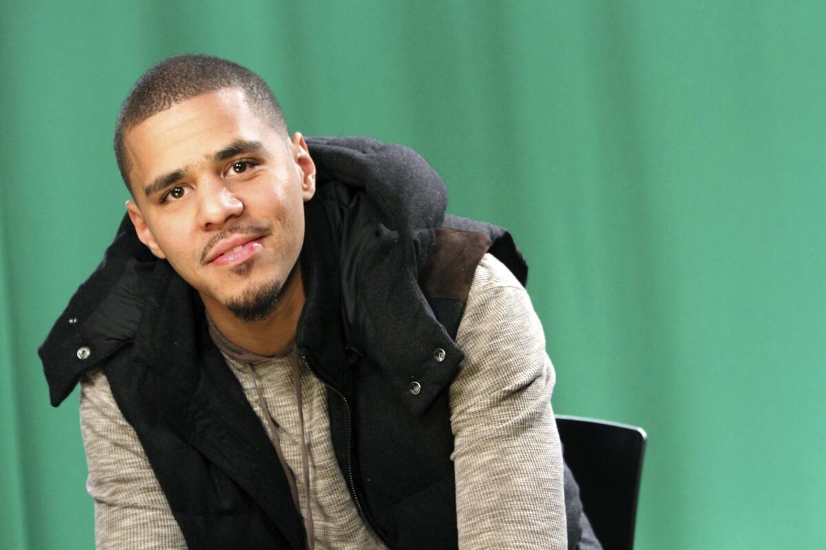 Man with black beard, J. Cole Holding Face, music stars, j. cole