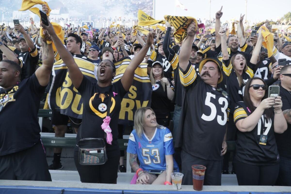 Chargers fan Kat Daly sits among the throngs of Steelers fans who attended Sunday’s game at Dignity Health Sports Park in 2019.
